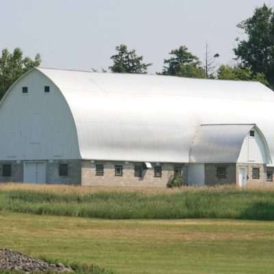 This barn is surrounded by a large open farm field with large piles of ice age rocks. Just outside of Gaastra MI in the township of Stambaugh.