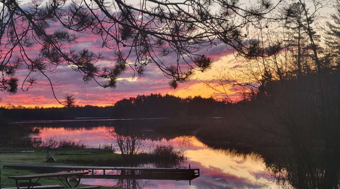 On Grand Portage Lake in the early Spring 2022 sunrise camping at the very nice Loon Lagoon Camp area in Mercer in Northern Wisconsin.