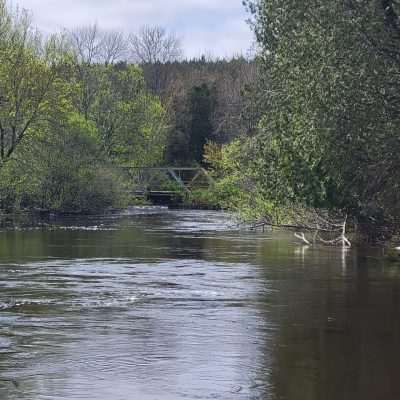 Zoom shot from an upriver point on the Brule River looking back at the Pentoga Road Bridge separating Michigan from Wisconsin.