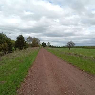 State Line Trail in early spring 2022 looking West with the private airport runway on the right.