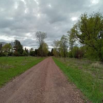 State Line Trail in early spring 2022 looking back east to Pentoga road.