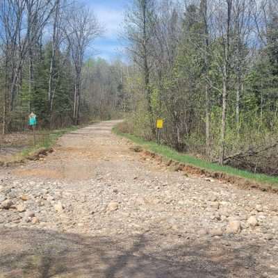 The Brule river among other rivers in the U.P. flooded the spring of 2023 due to a large snow pack and a very quick thaw. The bridge had water to the top, and the river formed a new river on the Wisconsin side tearing out the road and leaving this.