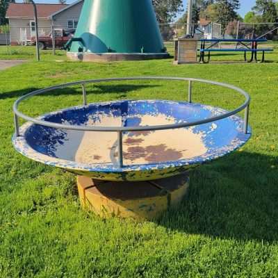 This old playground is under the water tower in Gaastra MI. The toys will bring back some great memories for our older viewers.