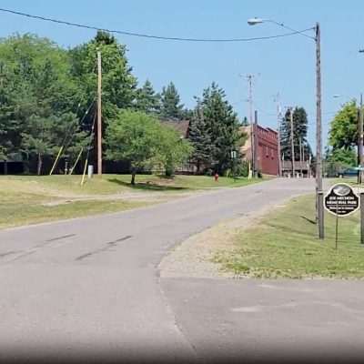 Cycling into Amasa Michigan in the U.P. on Old US Hwy 141.