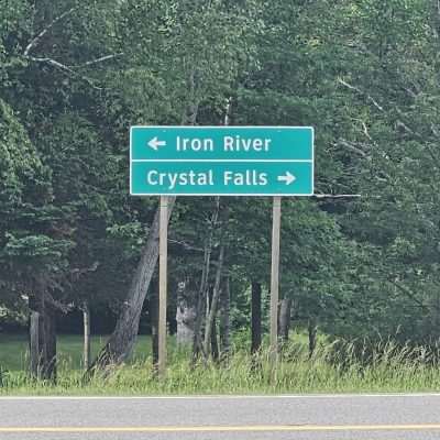 Road sign: Iron River left, Crystal Falls right