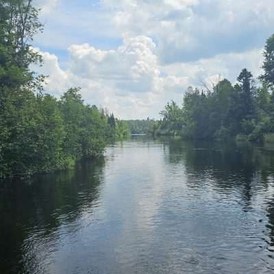 Peaceful river and lush greenery.