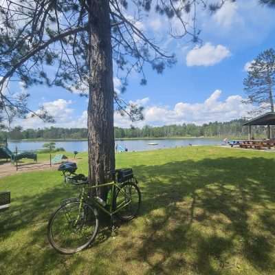 Park with bike, playground, and lake