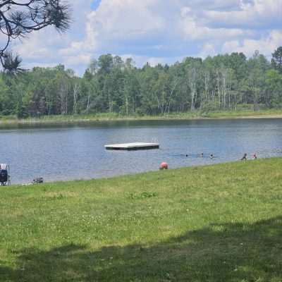 People enjoying a lakeside park.