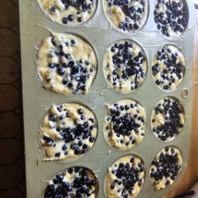 Blueberry muffin batter in baking tin