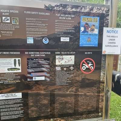 Park safety rules and surveillance notice. Signs at Way Dam Michigamme Reservoir Campground Site Wilderness Shores - WE Energies.