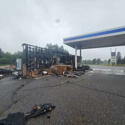 Burnt gas station remains, fire damage.