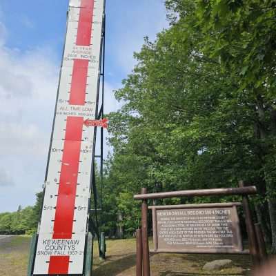 Keweenaw County snowfall record sign and measurement gauge.