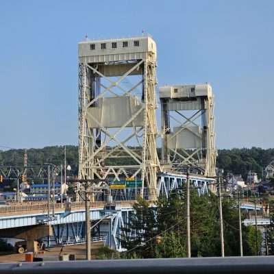 Large drawbridge over water in a small town.