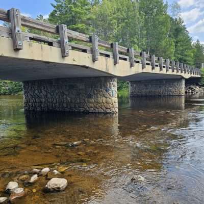 Stone bridge over a shallow river