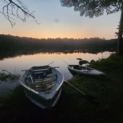 Two boats on Camp Three Lake in Northern Wisconsin at sunset